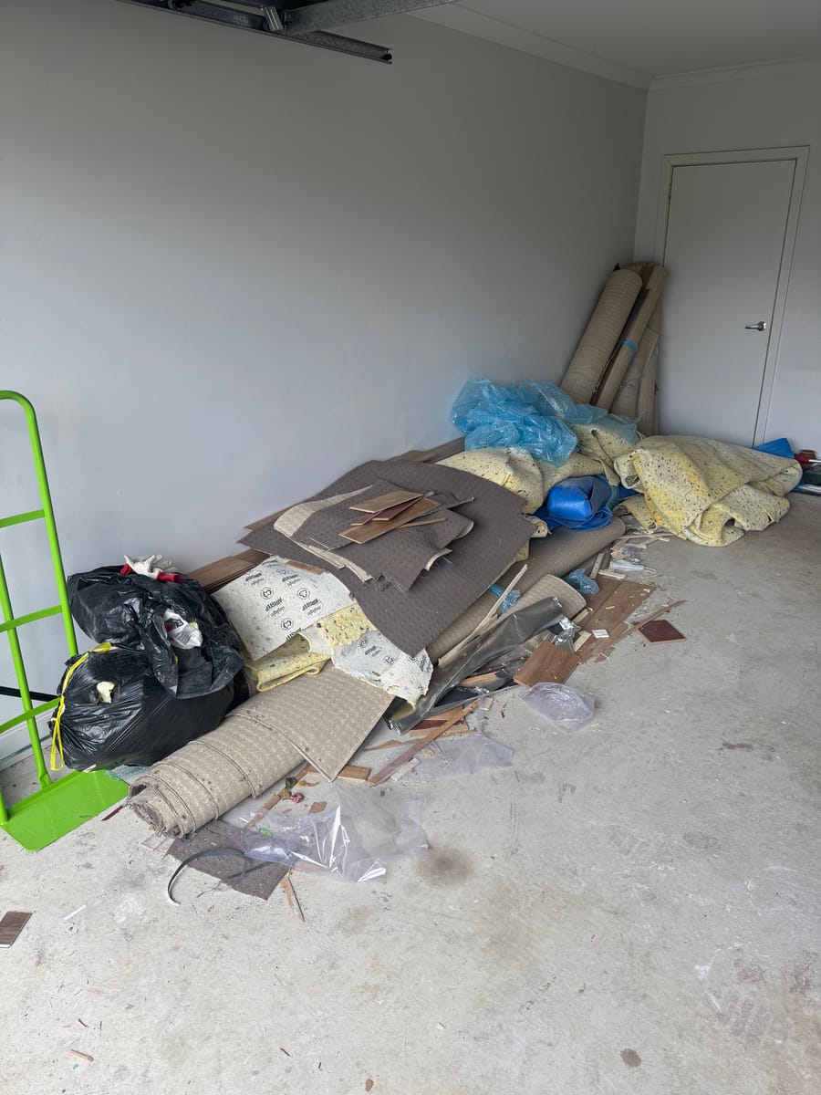 Garage filled with renovation debris before waste removal in Melbourne